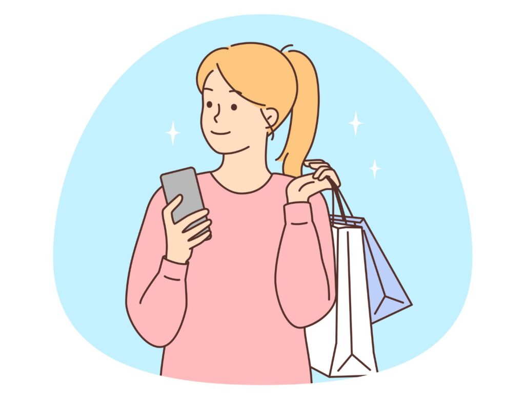 スマホを持つ女性のイメージ